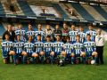 Plantilla del Deportivo campeón de España Juvenil en 1996, posando sobre el césped de Riazor con el trofeo. De pie, de izquierda a derecha: José María Blanco (entrenador), Nacho, Carlos, Pablo López, Diego Arias, Moscoso, Dani Mallo, Luis Mosquera, Araguás, Ramiro Amarelle y Julio Cagiao (delegado). Agachados: Adolfo, Roberto, Bugarín, Víctor, Juan Naya, Cedeira, Oliva, Coloma y Deus