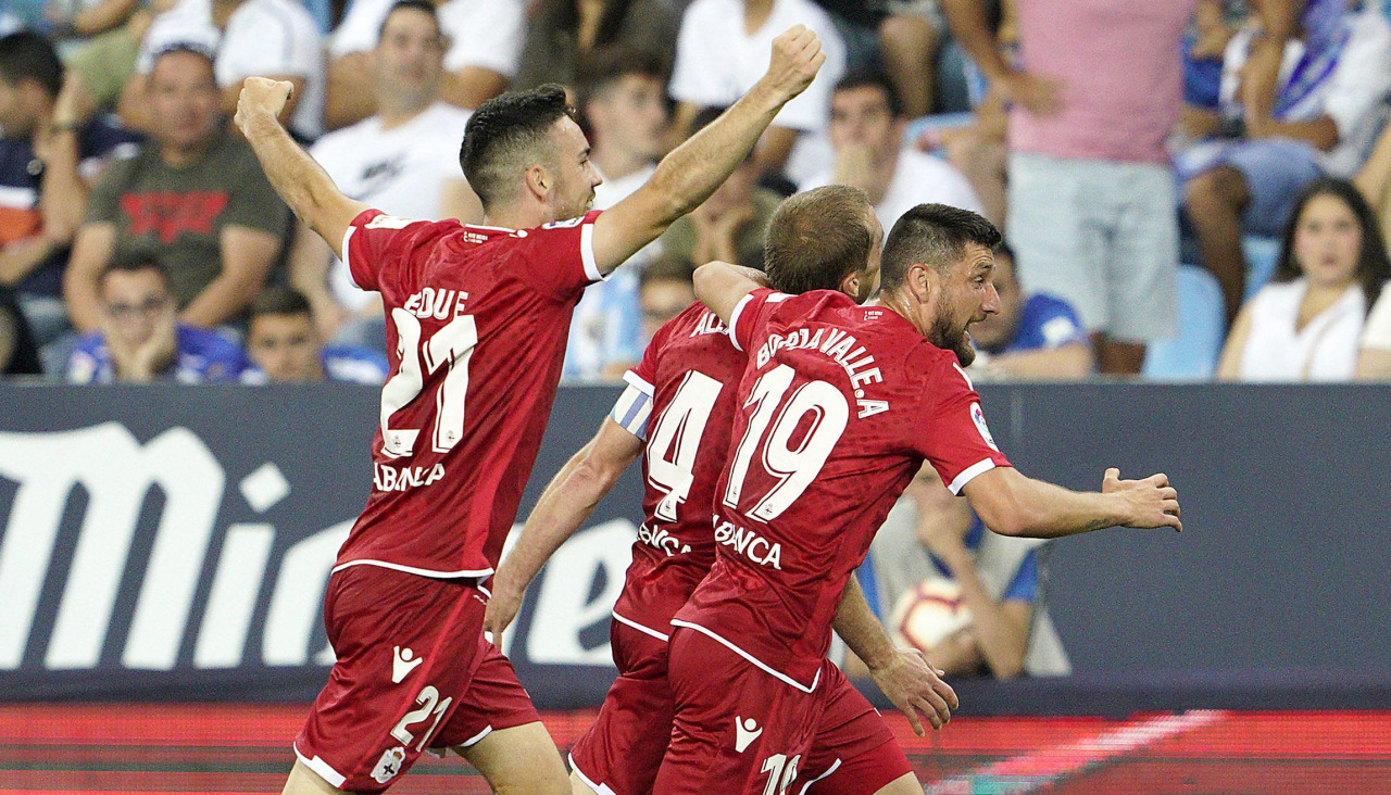 Edu Expósito y Borja Valle celebran junto a Bergantiños su tanto en La Rosaleda
