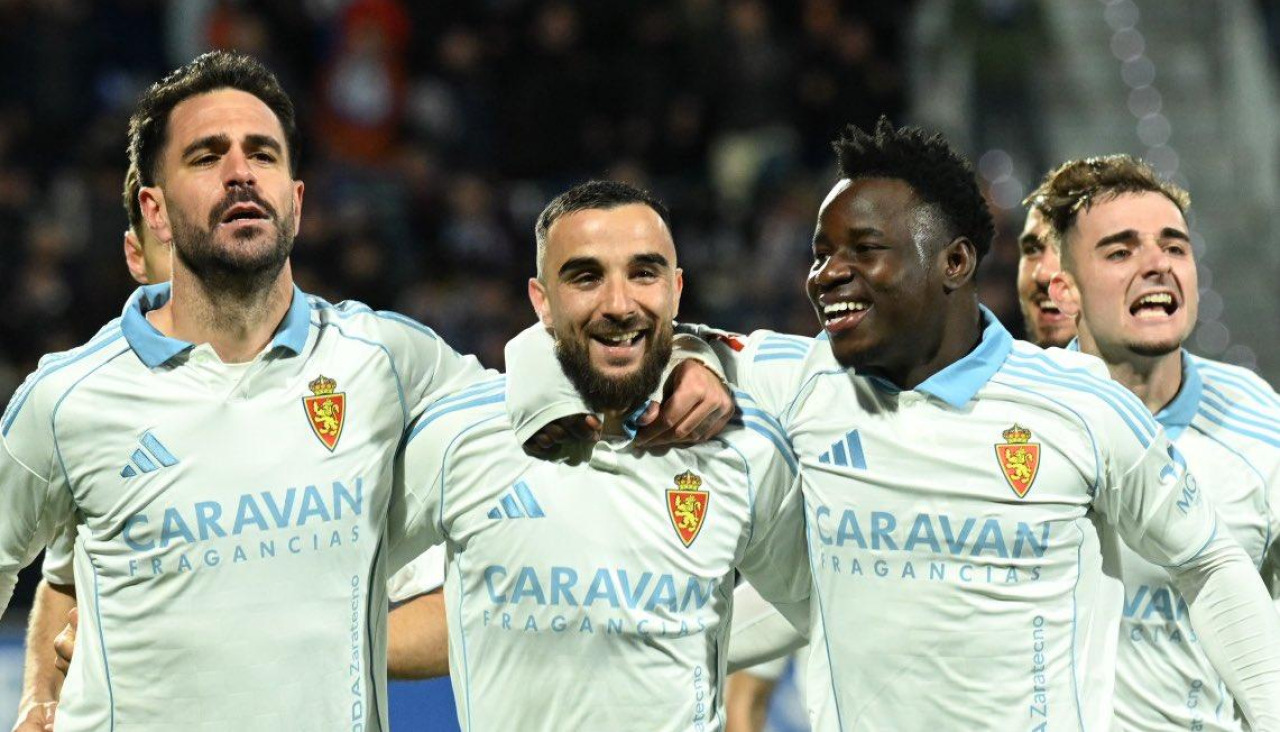 Insua, Rober y Mensah celebran uno de los goles frente al Almería
